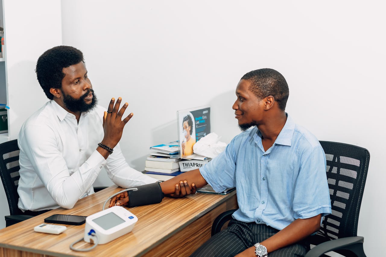 Services A medical professional consults with a patient during a blood pressure checkup in Lagos, Nigeria.